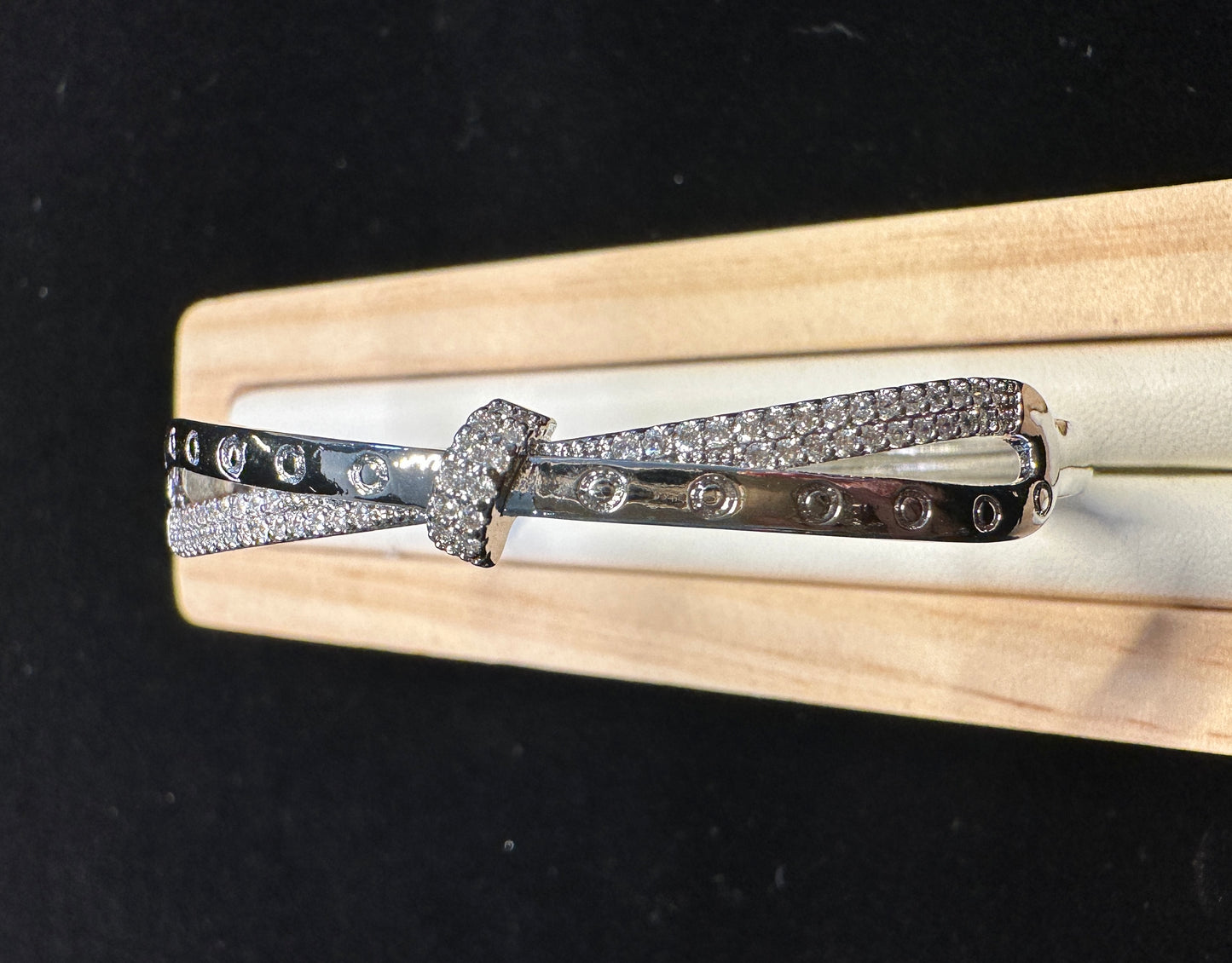Locus Cross Bangle | Geometric Bow Design in Silver Tone