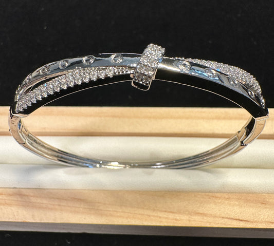 Locus Cross Bangle | Geometric Bow Design in Silver Tone