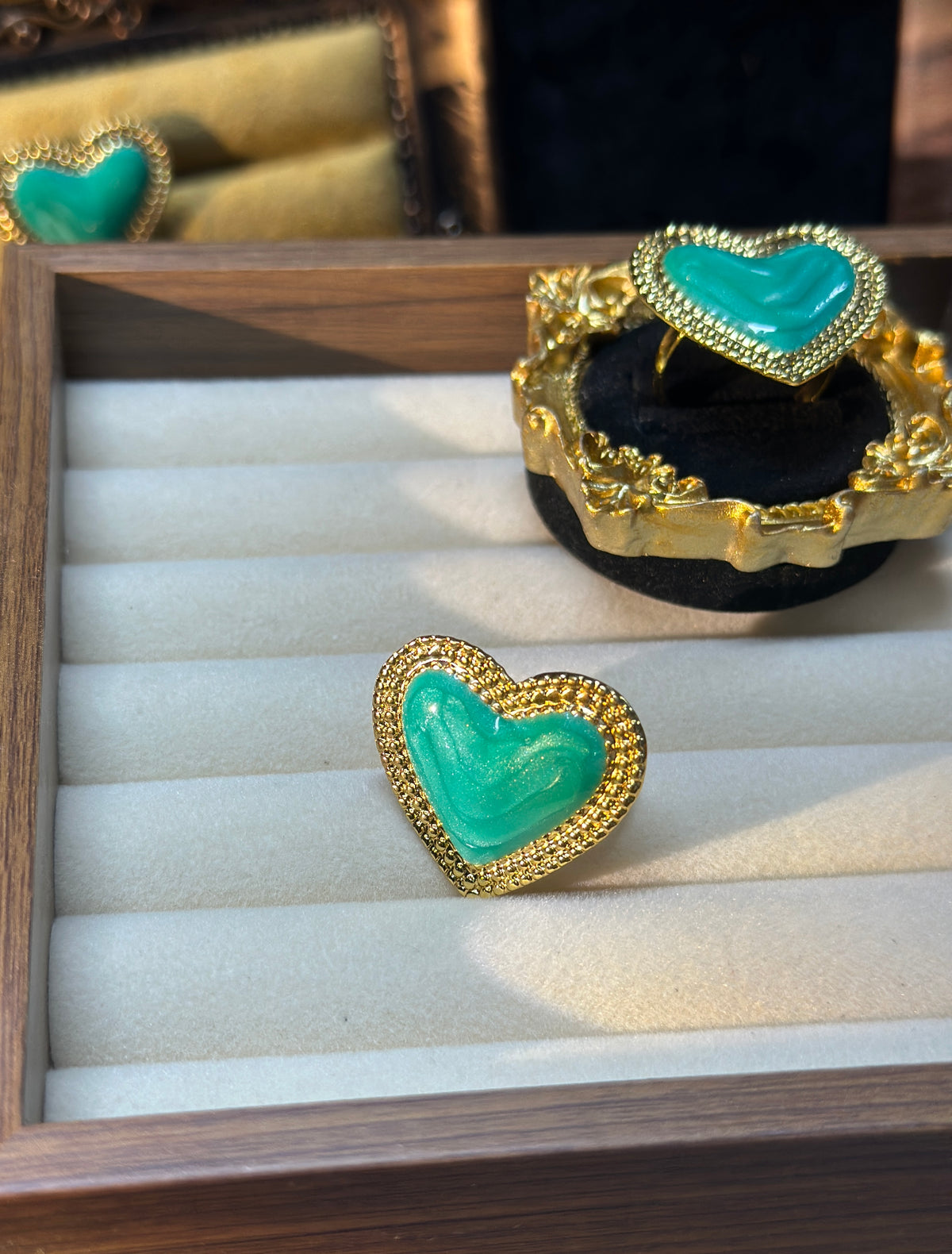 Green enamel heart statement ring with decorative gold-tone border
