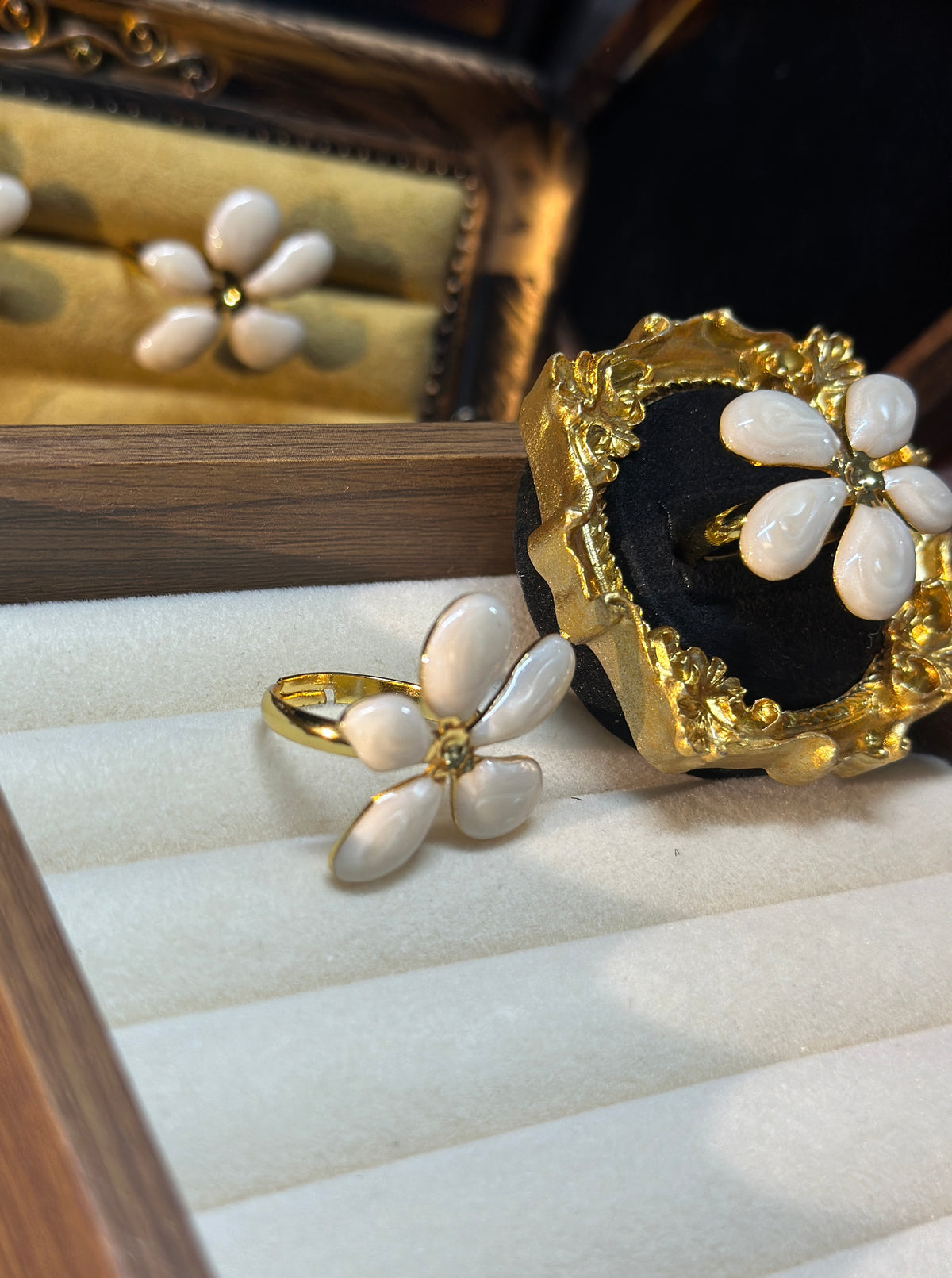 Ivory white five-petal flower adjustable ring with glossy irregular petals and gold-tone centre