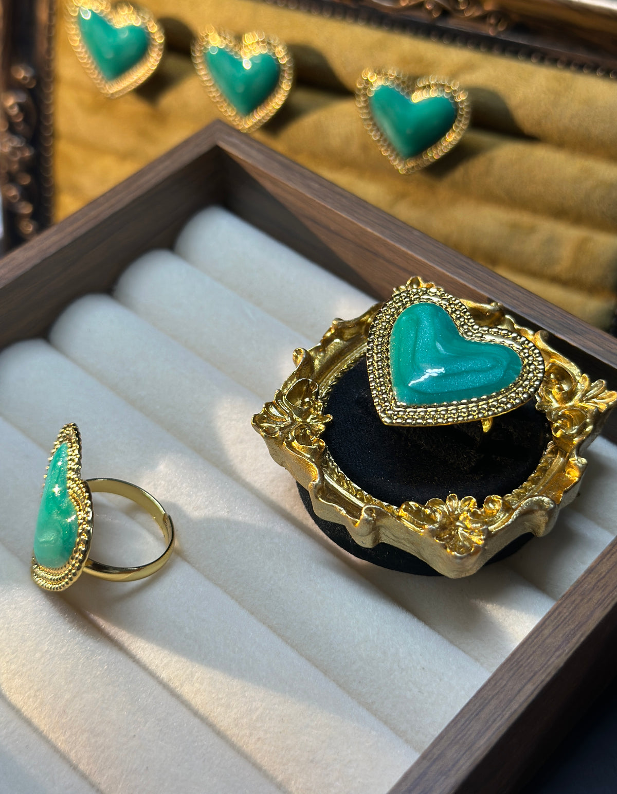 Green enamel heart statement ring with decorative gold-tone border