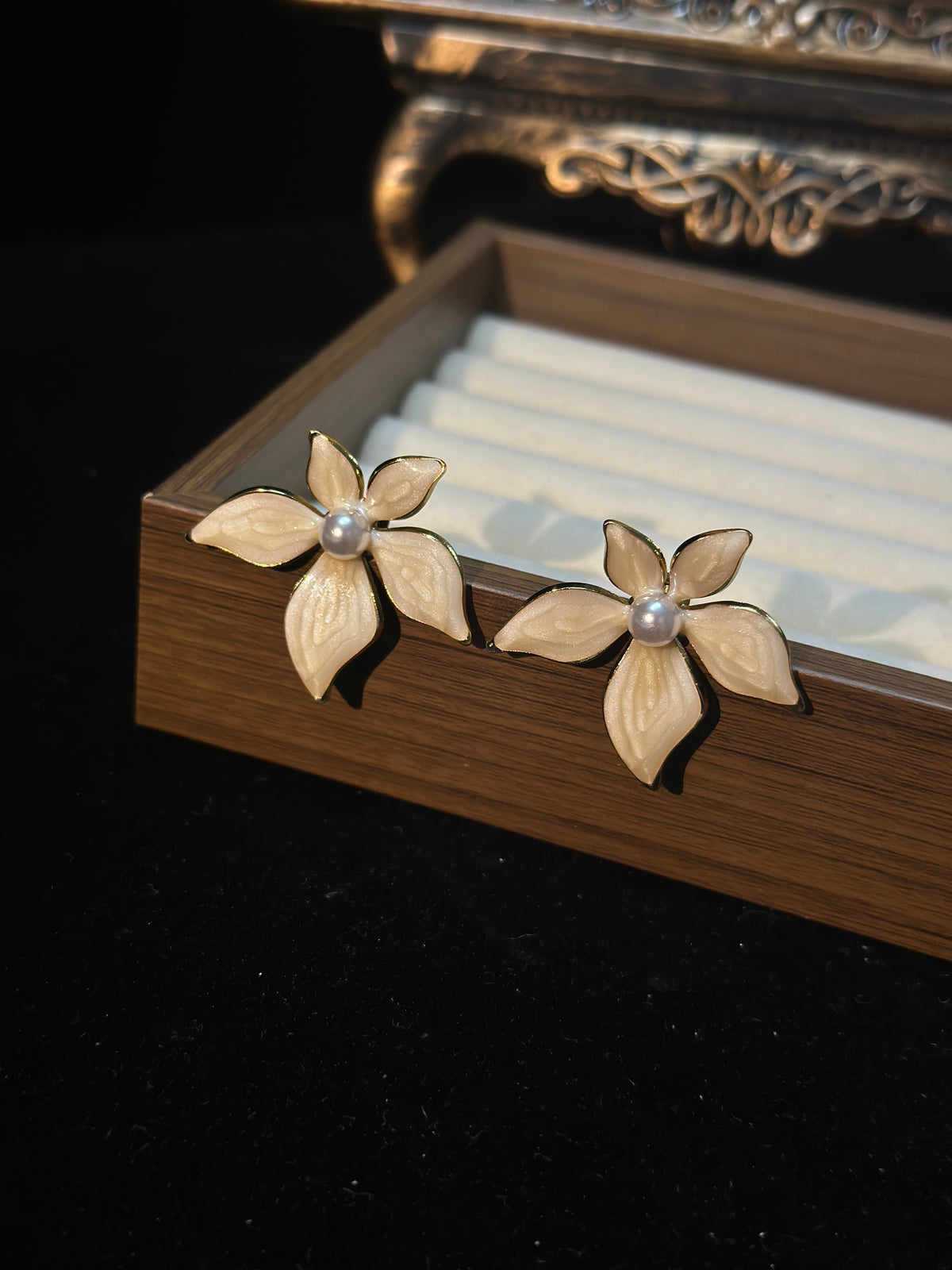 Ivory white pearl flower stud earrings with five textured pearlescent petals, gold-tone outlines and pearl-style centres