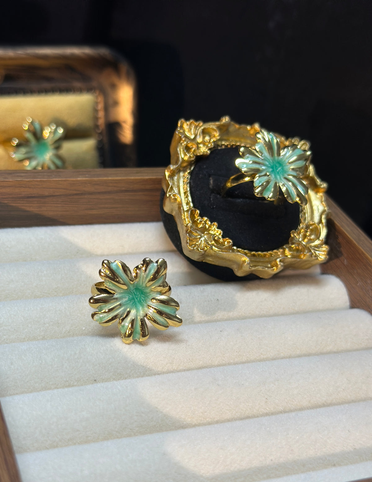 Mint green sunburst flower adjustable ring with pearlescent petals and gold-tone outlines