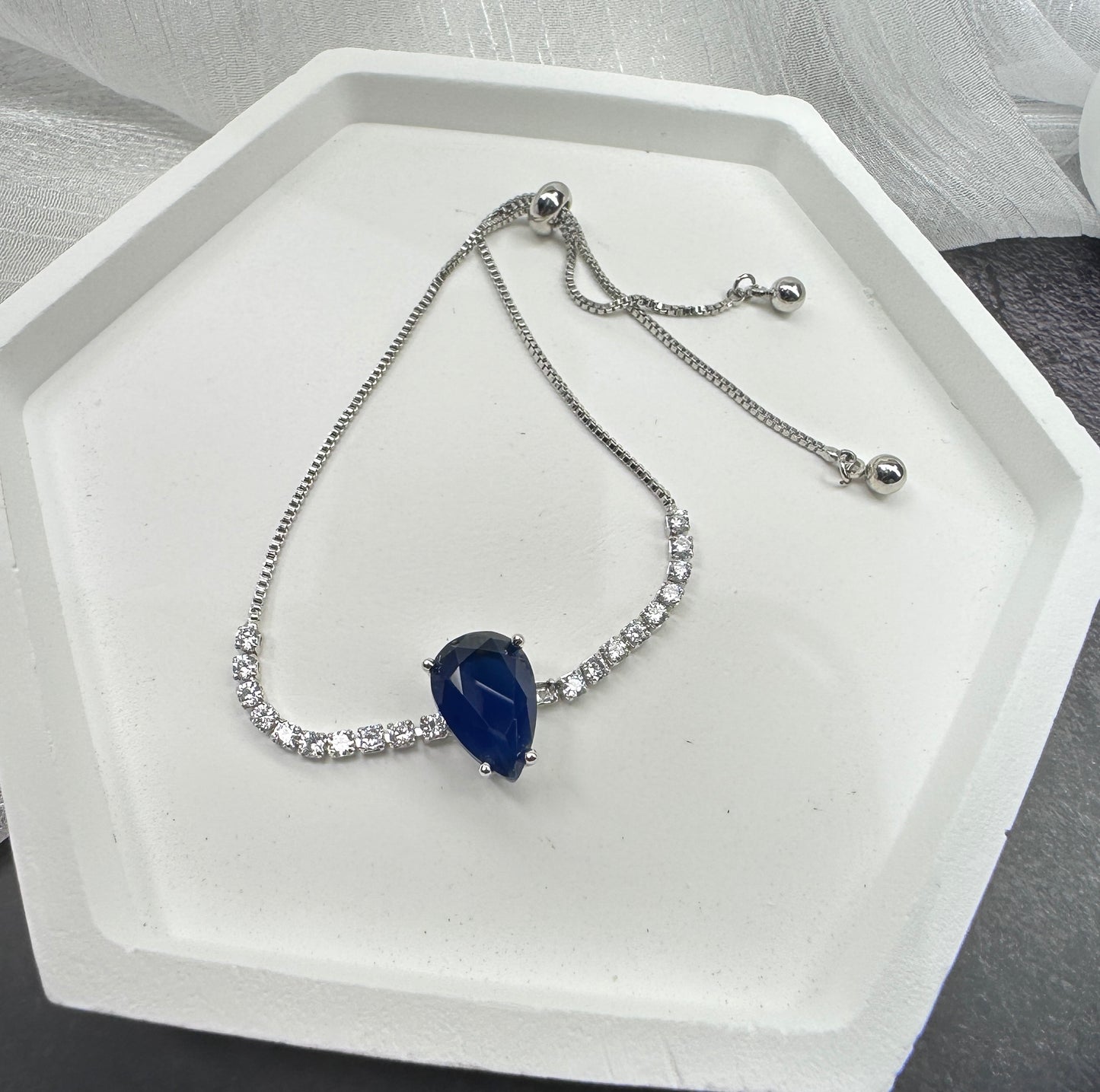Deep Sea Solitaire: Pear-cut Radiant Stone Adjustable Bracelet