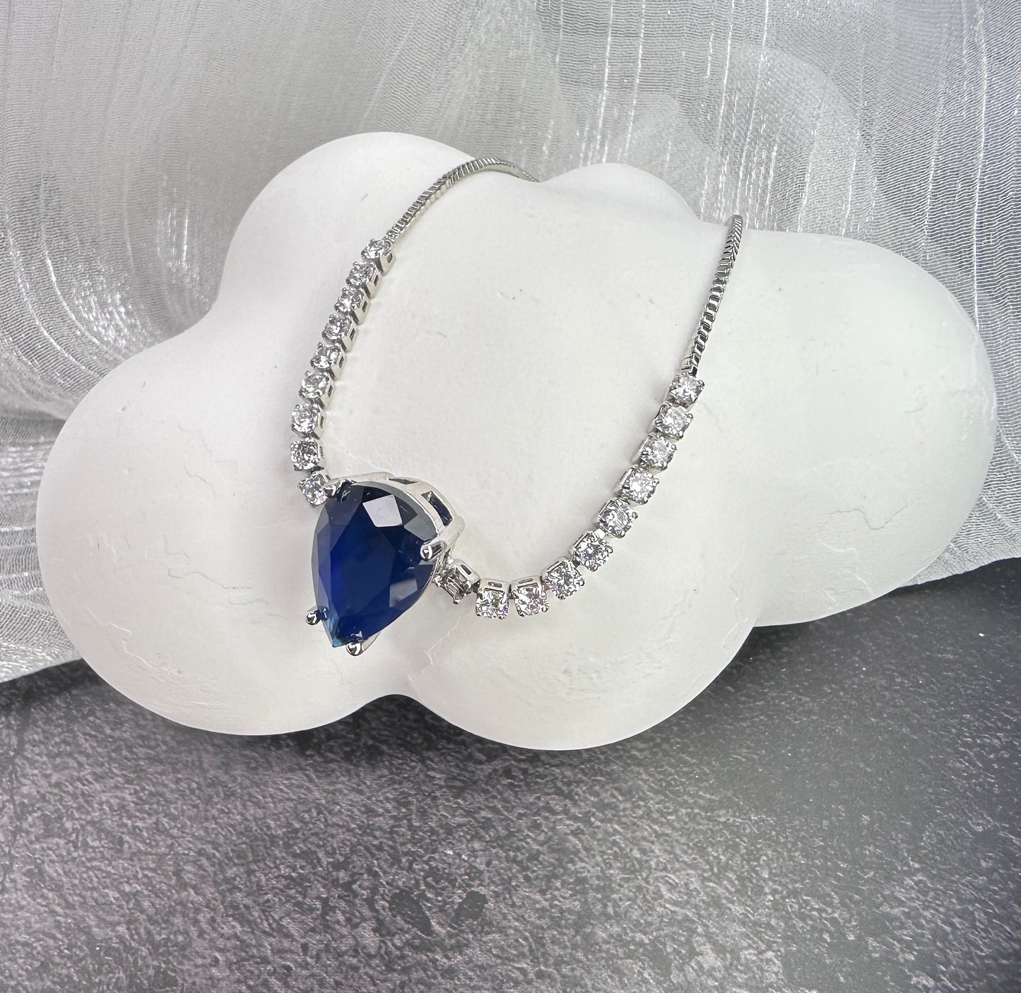 Deep Sea Solitaire: Pear-cut Radiant Stone Adjustable Bracelet