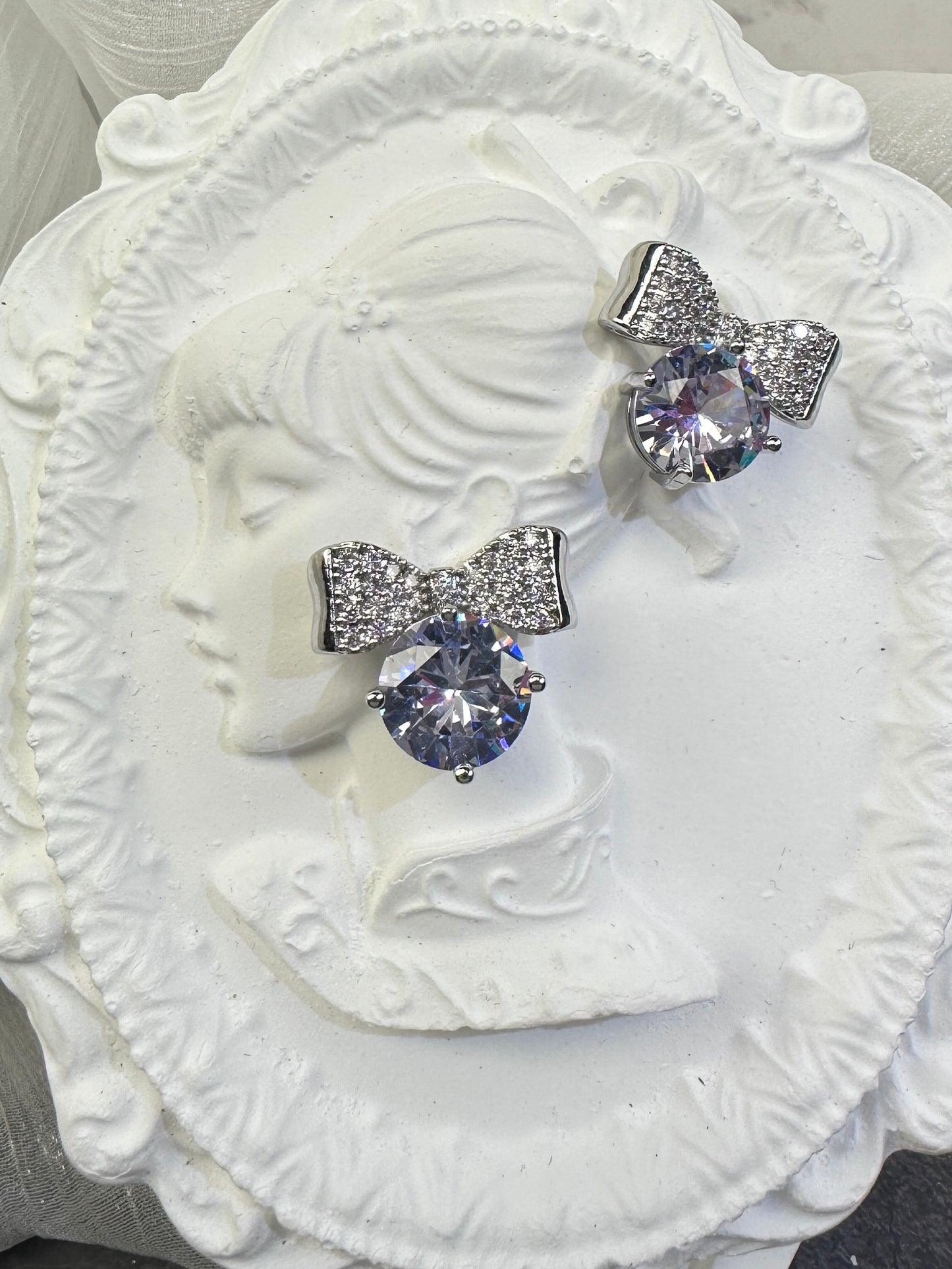 Brilliant Round-Cut Solitaire Studs with Pave Bow-Knot Accents