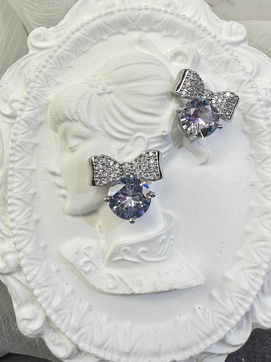 Brilliant Round-Cut Solitaire Studs with Pave Bow-Knot Accents