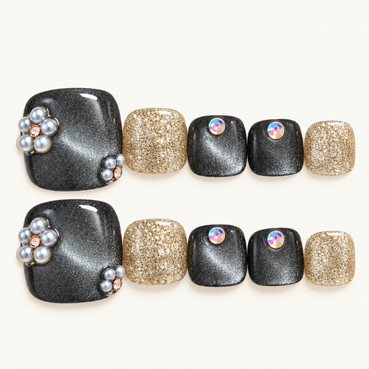 Charcoal cat-eye handmade press-on toenails with champagne gold glitter and dimensional silver floral embellishments