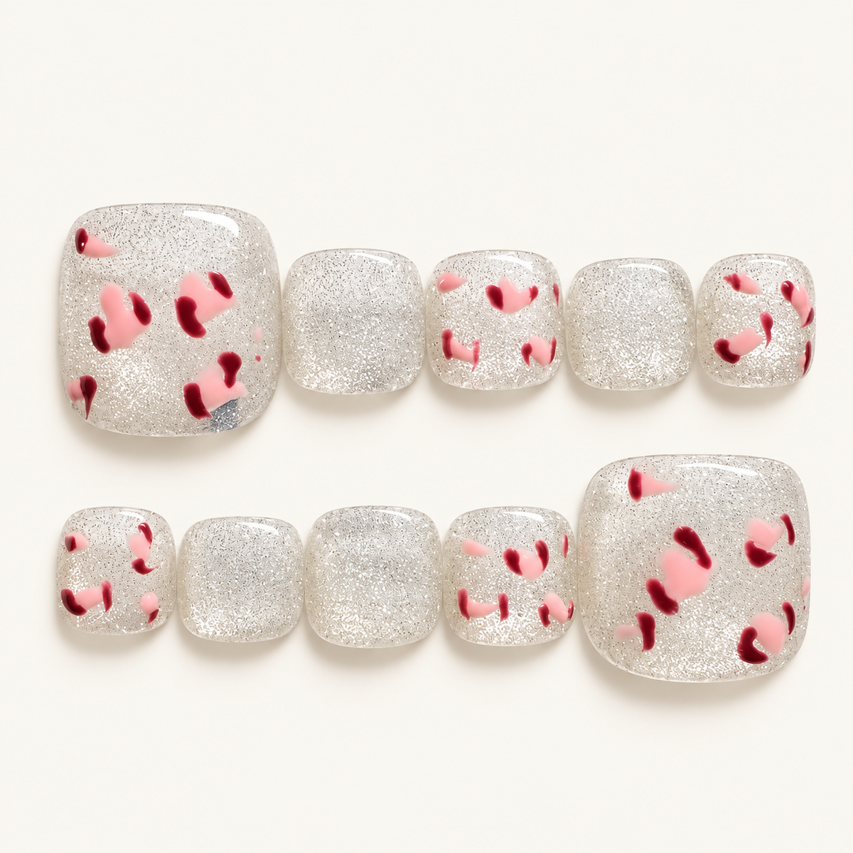 Silver-white glitter press-on toenails with pink and burgundy leopard print